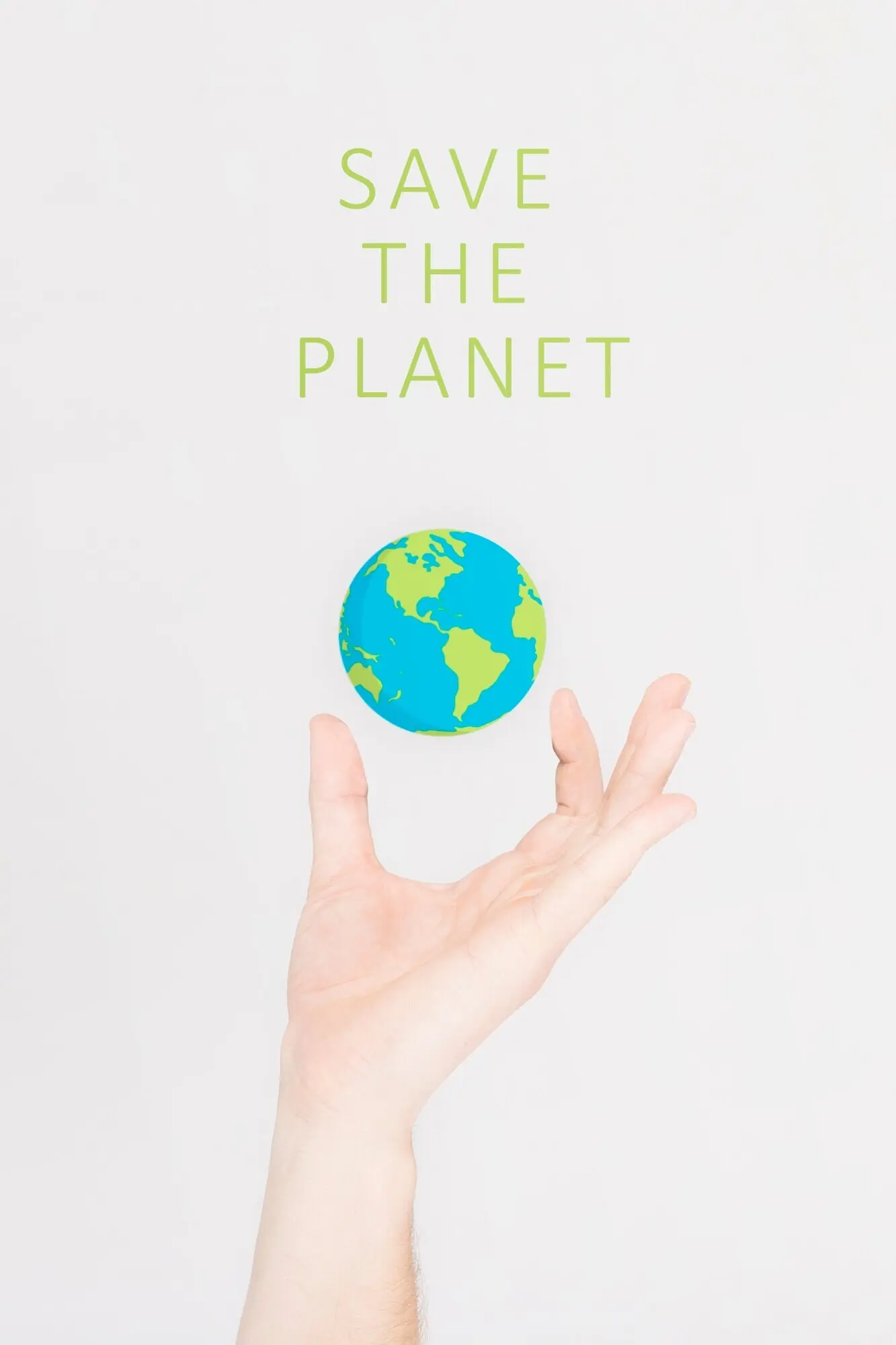 Cropped hand holding a small earth