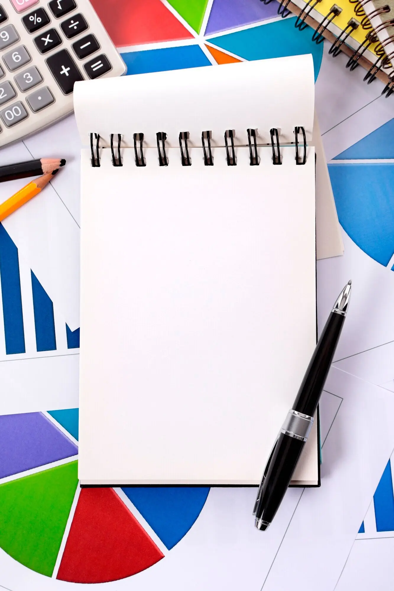 A blank notebook and a pen